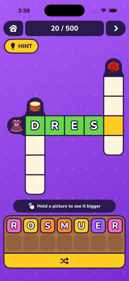 A crossword in play, with a dress, a drum and a rose as picture clues and the word DRESS spelled out in green.